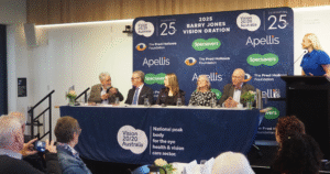 The 2025 Oration Panel speaking on stage.